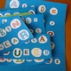 Improving literacy in bilingual children: iPhone apps and homemade board games